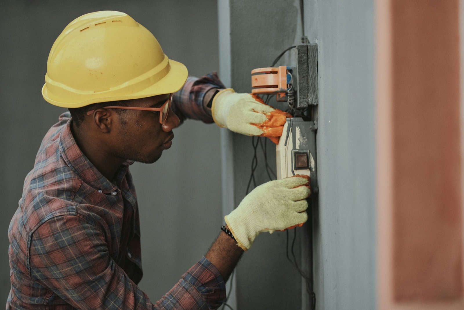 Licensed electrician working on a residential breaker panel and service entry in South Huron