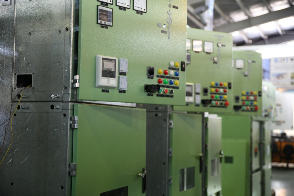 Industrial three-phase electrical distribution and motor control wiring in a commercial facility